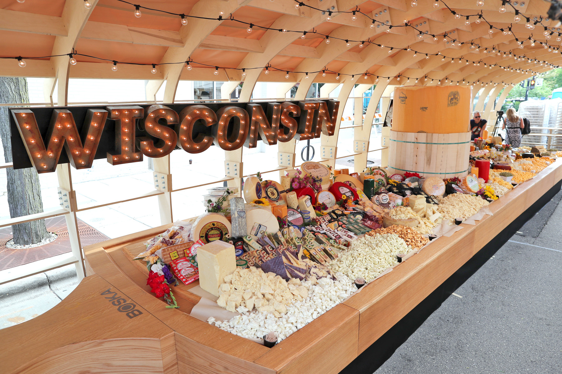 during a Guinness World Records winning attempt at the worlds largest cheeseboard in downtown Madison, Wis., on Wednesday, Aug. 1. The final weight of the cheese on the board came to 4,437 pounds.